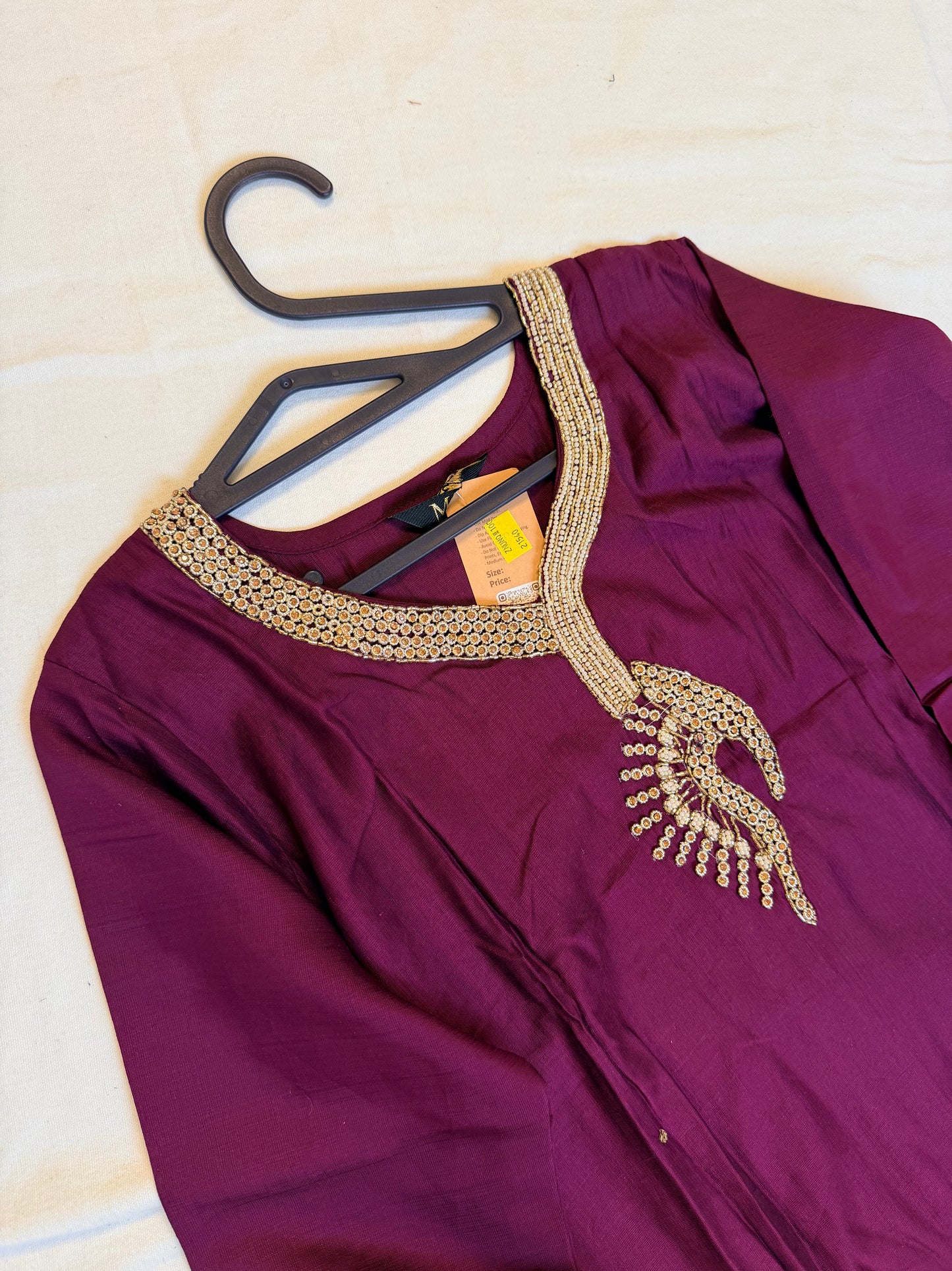 Purple traditional outfit with a patterned Dupatta