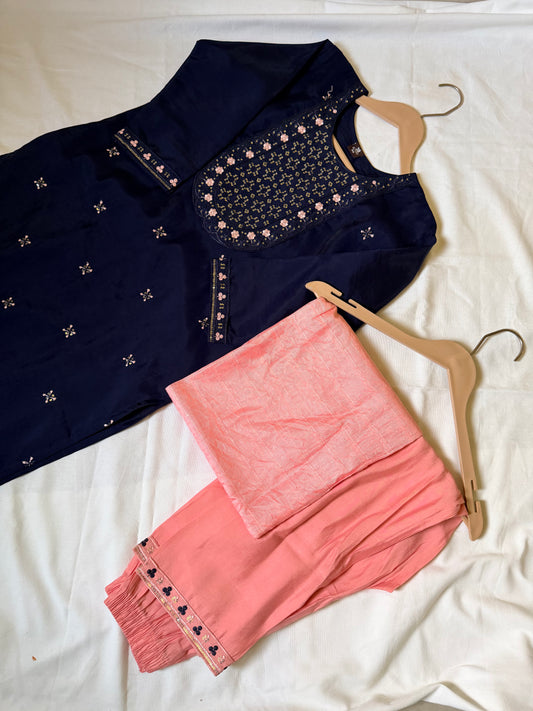 Navy blue embroidered top and pink pants