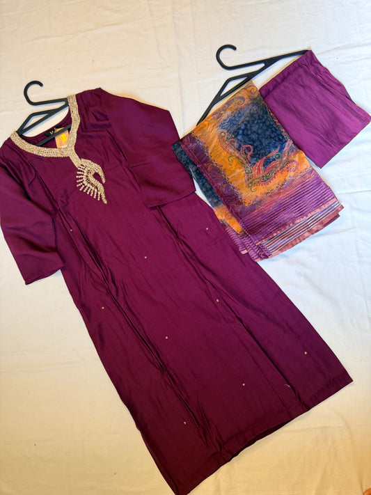 Purple traditional outfit with a patterned Dupatta