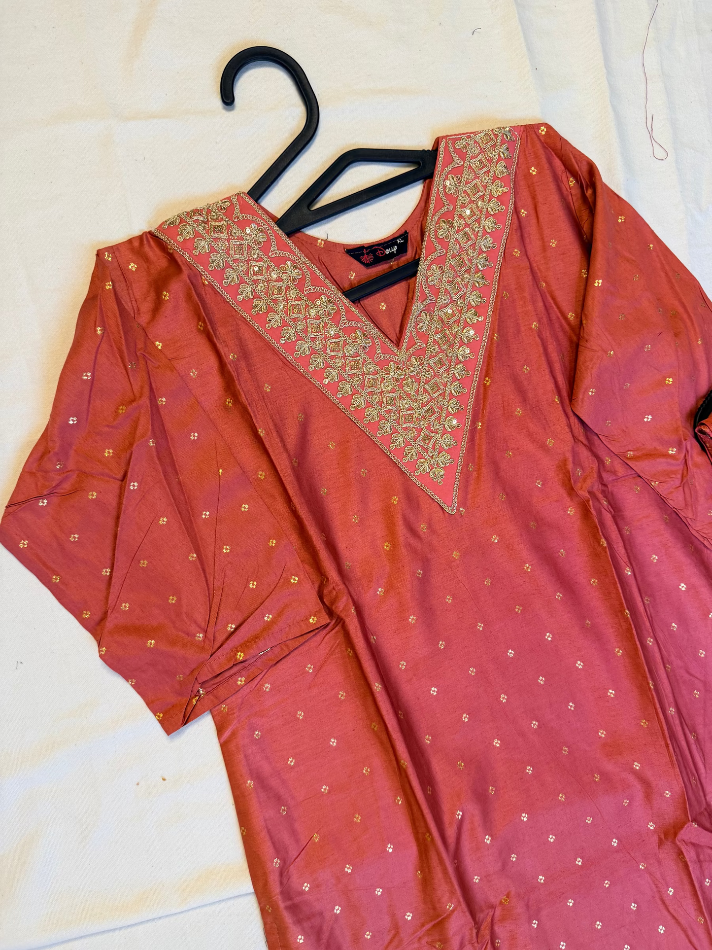 Peach traditional outfit with gold embroidery