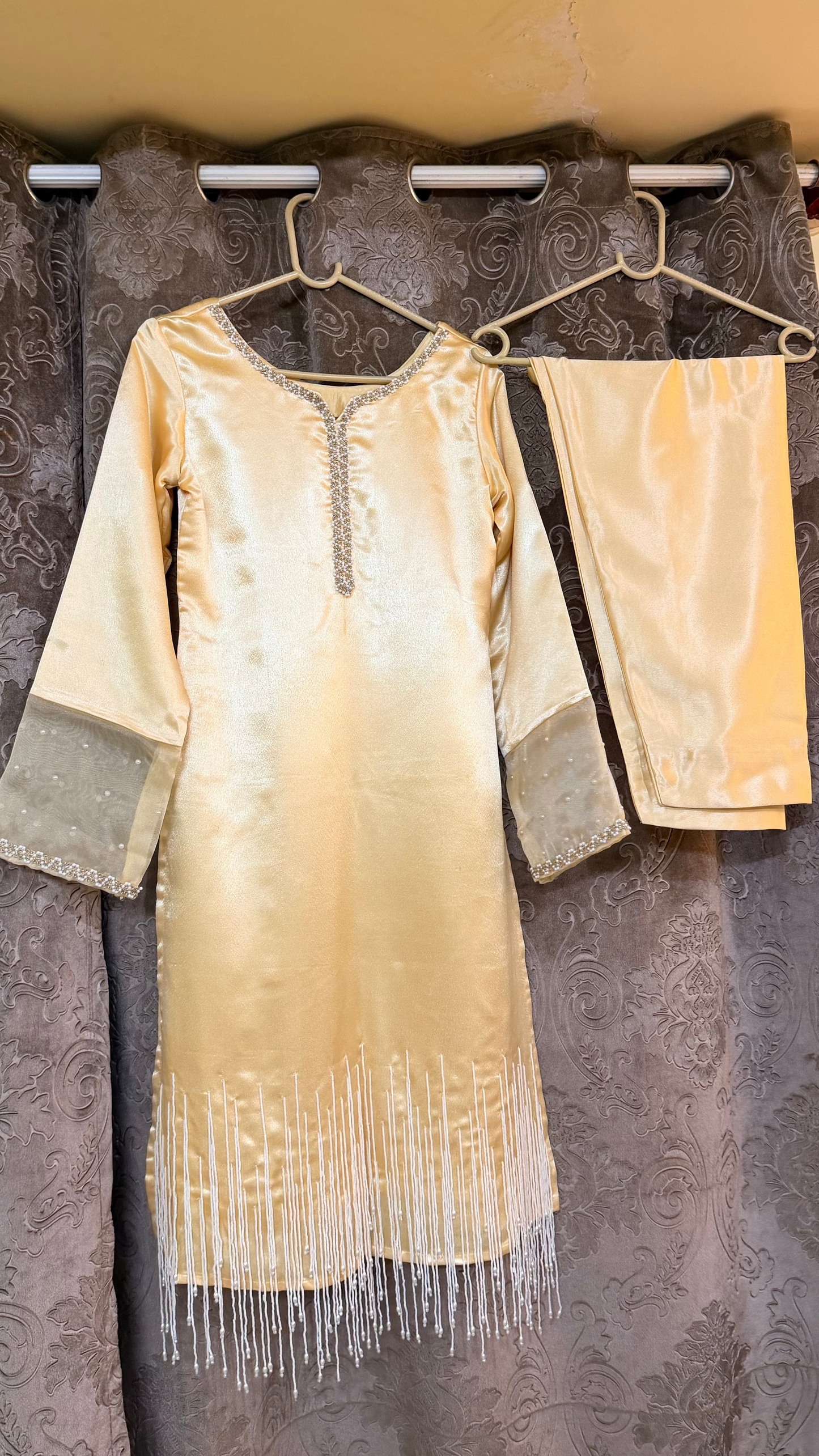 dress with fringe details hanging