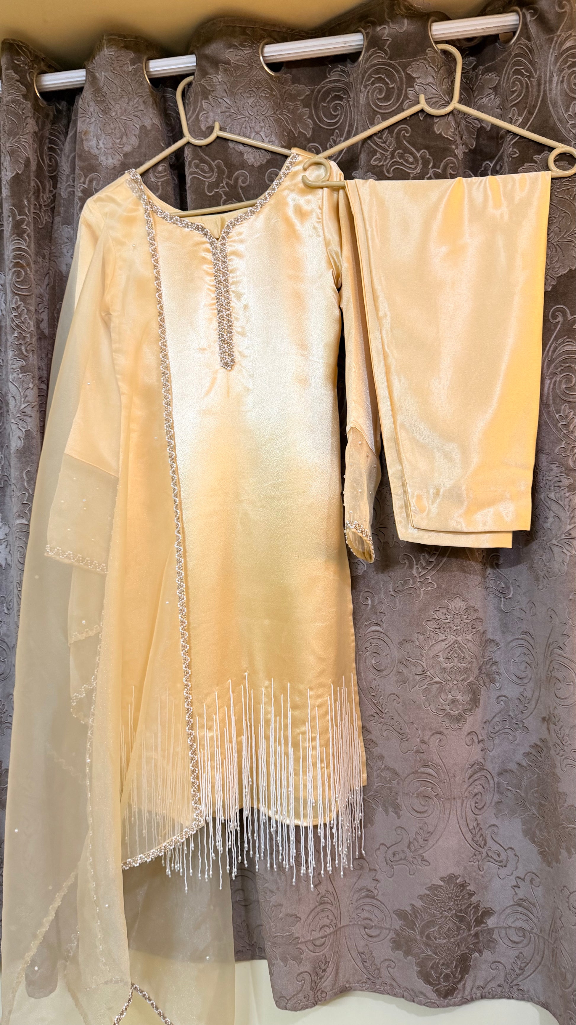 dress with fringe details hanging